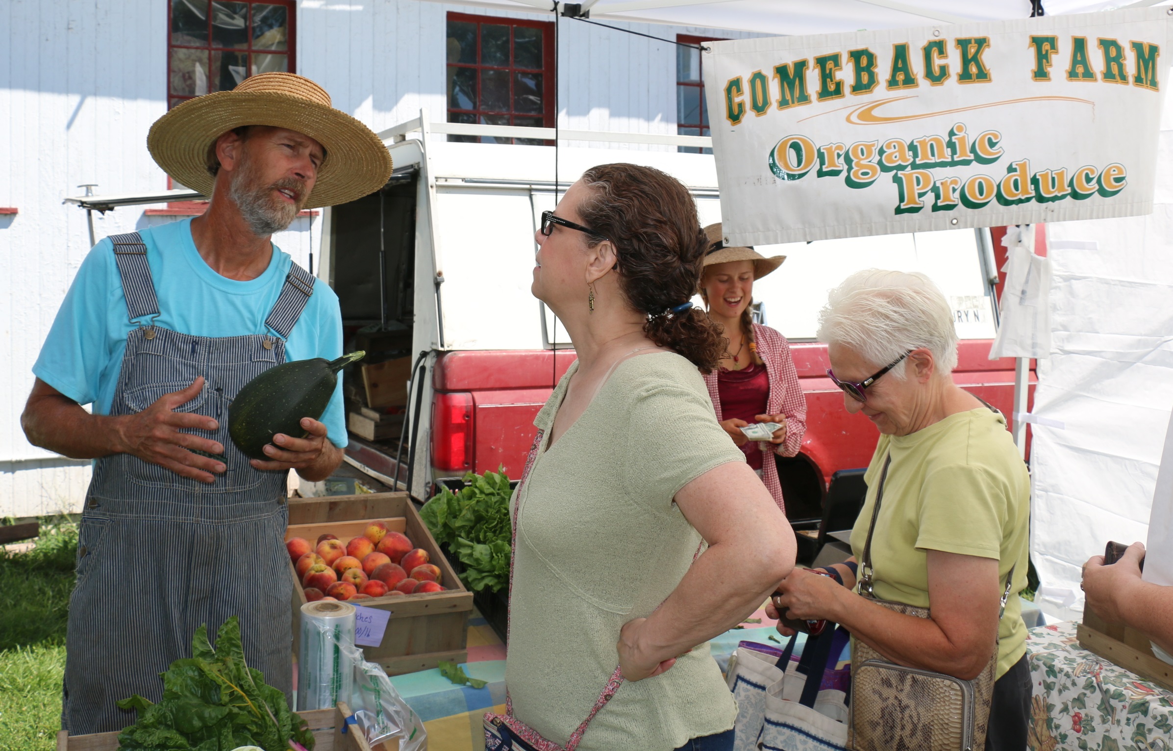 Comeback Farm's Mark Canfield chats with a customer at the Hunterdon Land Trust Farmers' Market.